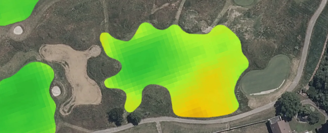 Turf greenness over an aerial photo of one fairway