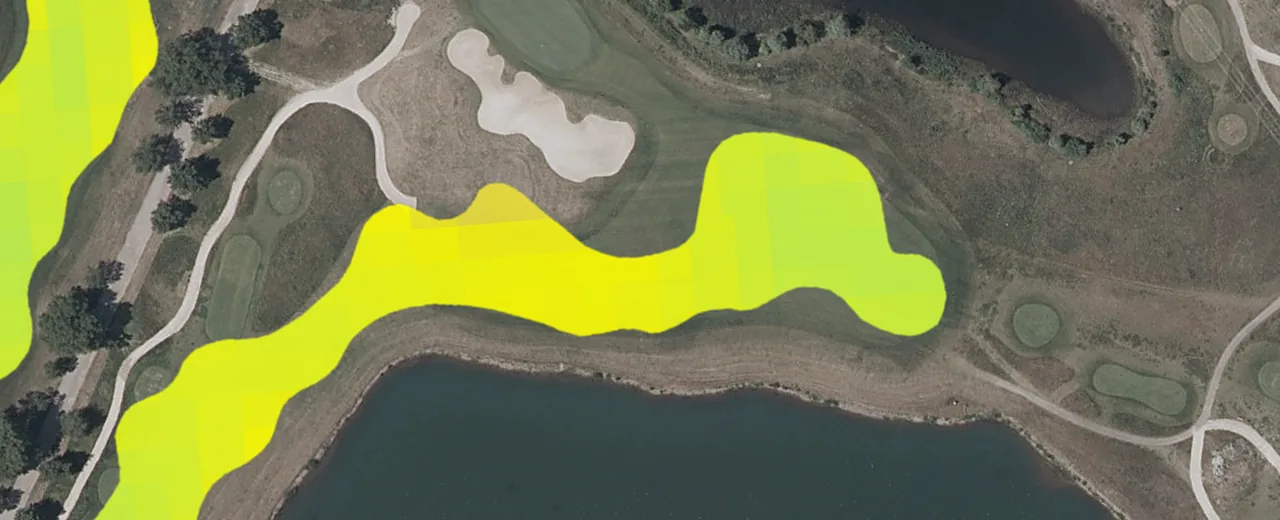 Grass moisture over an aerial photo of one fairway